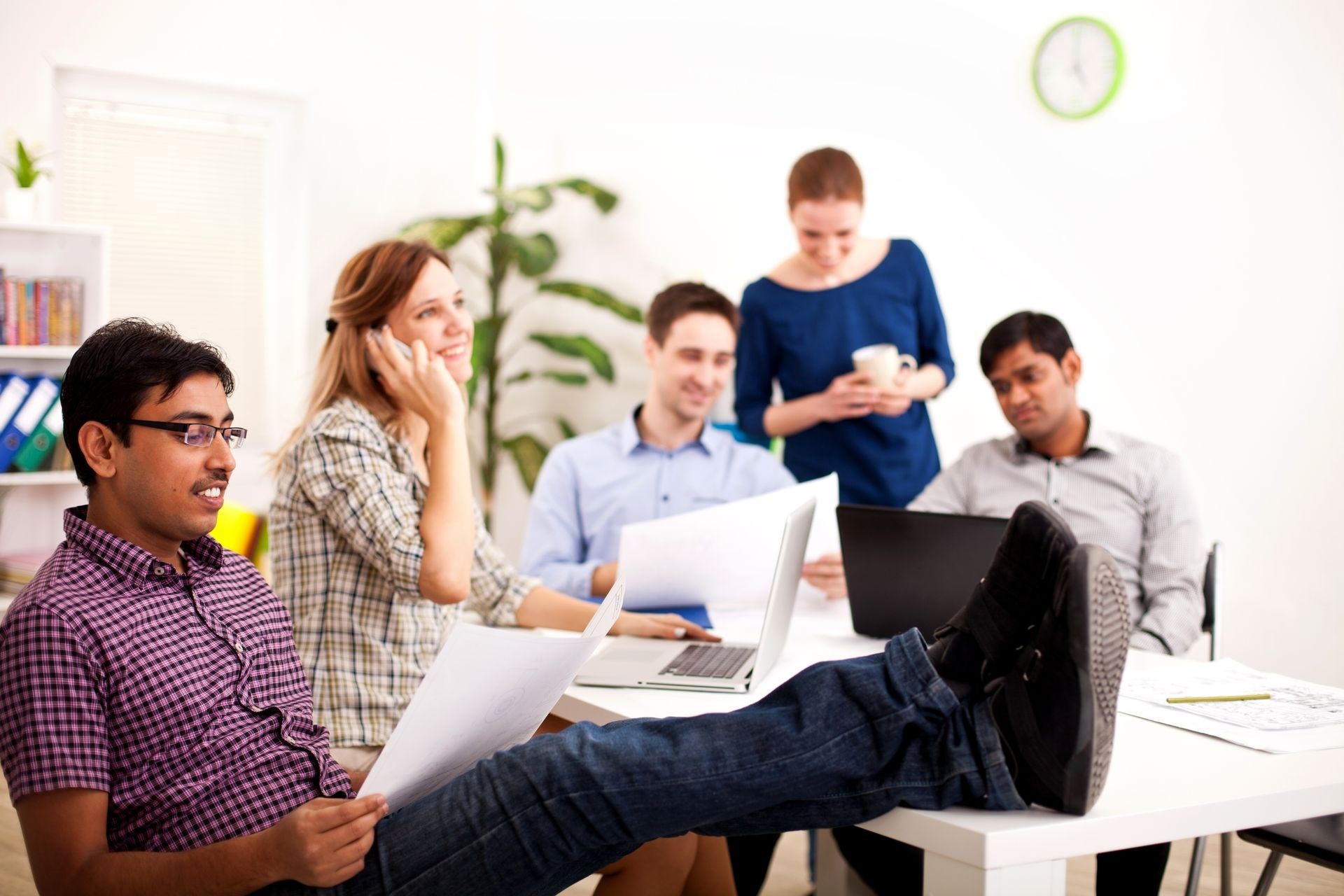 Young business people enjoying working  in the office